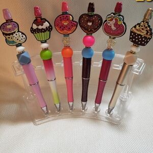 Hand beaded ink pens with silicone beads and rhinestones.